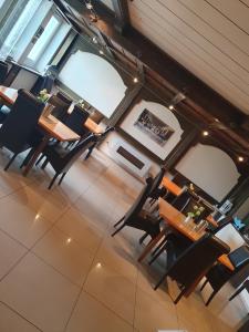 an overhead view of a dining room with tables and chairs at Hotel Sonnenhof in Illertissen