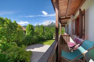 a balcony with a view of a mountain at Villa Cleila Verde B in San Vito di Cadore