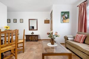 a living room with a couch and a table at Casa Maria Cosme in Los Realejos