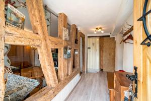 a living room with wooden walls and wooden floors at Schwarzwald Ruhe in Altensteig