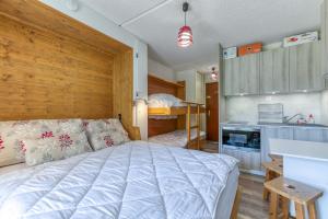 a bedroom with a bed and a bunk bed at Studio équipé Avec Balcon Fermé in La Morte +17 photos