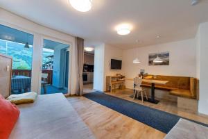 a living room with a couch and a table at Gass Apartment B in Laion