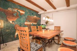 a dining room with a wooden table and chairs at Ferienwohnung Relax in Sigmarszell