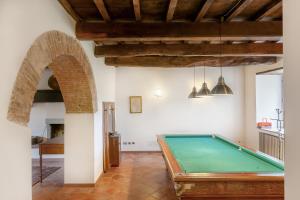a pool table in the middle of a room at Universal Harmony - Pettirosso in Dicomano