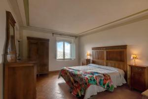 a bedroom with a bed and a window at Universal Harmony - Pettirosso in Dicomano +23 photos