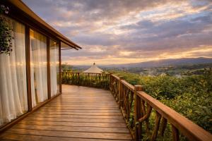 a wooden walkway on a house with a view at Hemma Genki Luxury Wellness Hotel Villa in Villa de Leyva