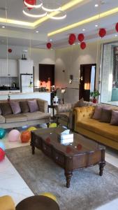 a living room with couches and a coffee table at فلل لوسيرن in Khamis Mushayt