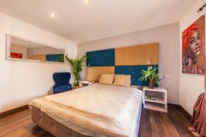 a bedroom with a bed and a painting on the wall at Casa Varna in Capdepera +26 photos