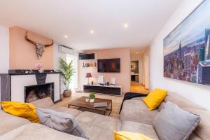 a living room with a couch and a fireplace at Casa Varna in Capdepera