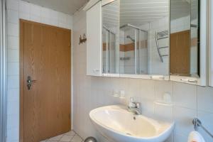 a bathroom with a sink and a mirror at Haus Schussenblick Og in Eriskirch +13 photos