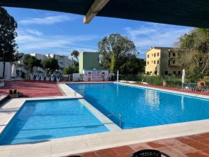 a large swimming pool with blue water at Brava Beach in Platja d'Aro