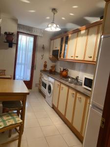 a kitchen with a sink and a dishwasher at Montes de Alhama Il in Soria