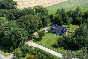 an aerial view of a house in a field at Landhaus Sommerland in Uelvesbüll