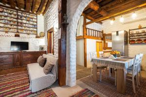 a kitchen and dining room with a table and chairs at Mannas House in Émbonas
