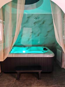 a bath tub in a room with a curtain at Mannas House in Émbonas +28 photos