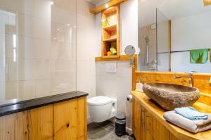 a bathroom with a sink and a toilet at Gästehaus Wüpping 1 in Salem +22 photos