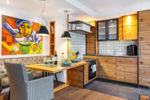 a kitchen with a table and a painting on the wall at Gästehaus Wüpping 1 in Salem