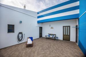 a large room with blue and white walls at Cabo de Sagres -2 bedroom apartment in Sagres