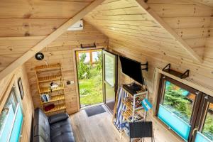 an overhead view of a tiny house with a large window at Tiny House Evita in Lehnin