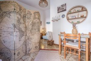 a large room with a large map on the wall at Tyndaris home in Oliveri +10 photos