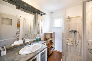 a bathroom with a sink and a shower at Chalet Les Tourelles in Aix-les-Bains +25 photos