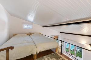 a bedroom with a bed and a balcony at Casa das Cantonas Valada in Valada +21 photos