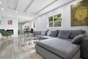 a living room with a couch and a table at Apartamento 7 dioses in Puerto del Rosario