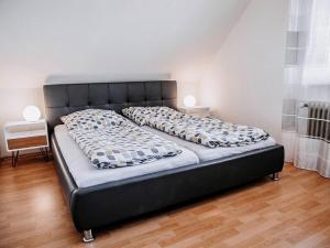 a bed in a room with two pillows on it at Auszeit am See in Moos