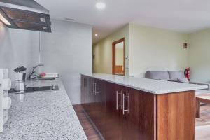 a kitchen with a counter top in a room at Valle del Ibias - Primero Derecha in Cecos