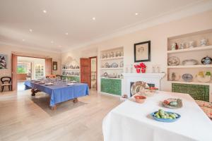 a dining room with a table and a fireplace at Ca Nostra de Esporlas in Esporlas
