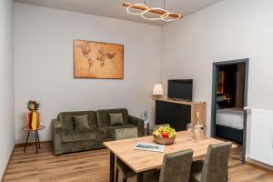 a living room with a couch and a table at Residency NO7 in Berlin