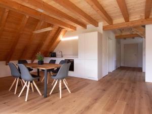 a kitchen and dining room with a table and chairs at Haus Mühlenfranzenhof in Schönwald