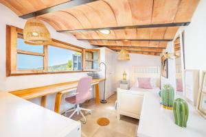an office in a tiny house with a desk at Els Abats in Fornalutx