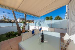 a view from the balcony of a house with a table and chairs at Can Bennasar in Can Picafort
