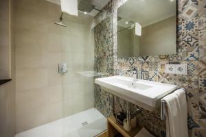 a bathroom with a sink and a mirror at Apartament Massanet 1a in Canyamel +22 photos