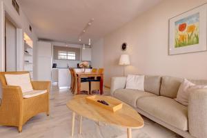 a living room with a couch and a table at Apartment Boulevard 302 in Estepona