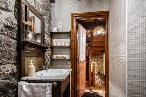 a bathroom with a sink and a mirror at La Breval in Alles
