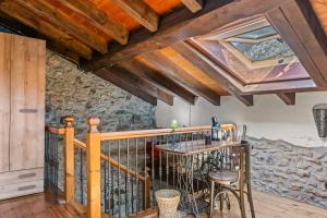a room with a balcony with a table and chairs at La Breval in Alles +19 photos