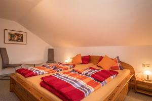 a bedroom with two beds in a attic at Ferienwohnung Steinhilber 1 in Eriskirch