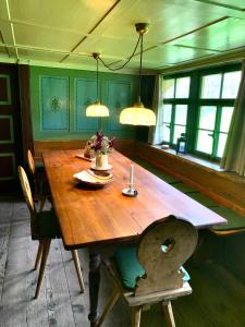 a wooden table with two lamps on top of it at Ferienhaus Hederle in Elzach