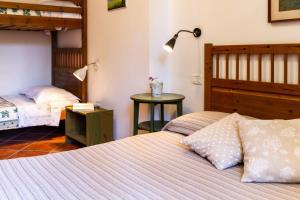 two beds in a room with two bunk beds at Bilo Camelia in Marina di Grosseto +23 photos