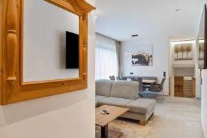 a living room with a couch and a table at Ferienwohnung Elsa in Fliess