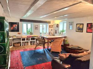 a living room with a table and a couch at Charming House in Neckargemünd