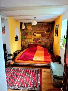 a large bed in a room with a brick wall at Charming House in Neckargemünd