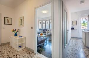 a hallway with a door leading to a living room at Liver 203 in Tremosine Sul Garda
