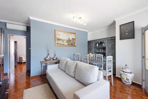 a living room with a couch and a table at Casa Da Jesus in Provesende