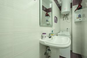 a white bathroom with a sink and a toilet at Casa Caletillas in Candelaria +20 photos