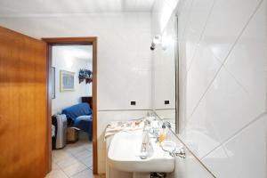 a bathroom with a sink and a mirror at La Torre in Arcola +16 photos