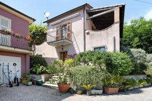 a house with potted plants in front of it at La Torre in Arcola