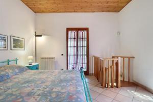 a bedroom with a bed and a window at La Torre in Arcola